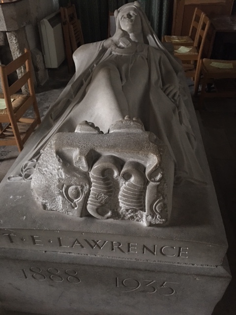 A stone memorial of Lawrence of Arabia within the Saxon Walls of Wareham
